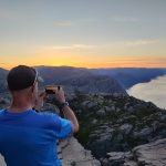 Early Morning Training at Pulpit Rock Early morning training on the mountain trail to Pulpit Rock overlooking the Lysefjord region in Norway.
