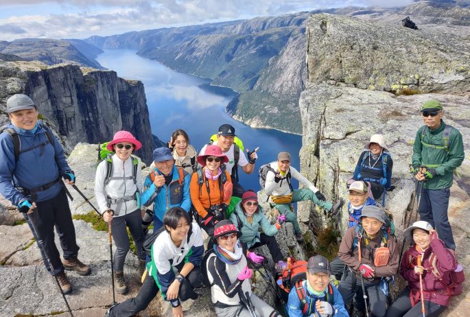 Best-hikes-norway-Hiking-up-kjerag-norway-a-must-do-in-stavanger-troll-adventure-here-with-a-group-from-south-korea(2)